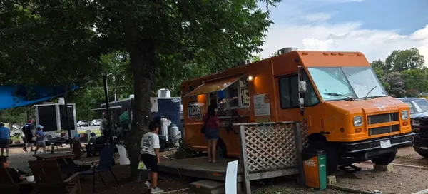 Orange Boss Tacos truck, a steady line, proper Leander street food