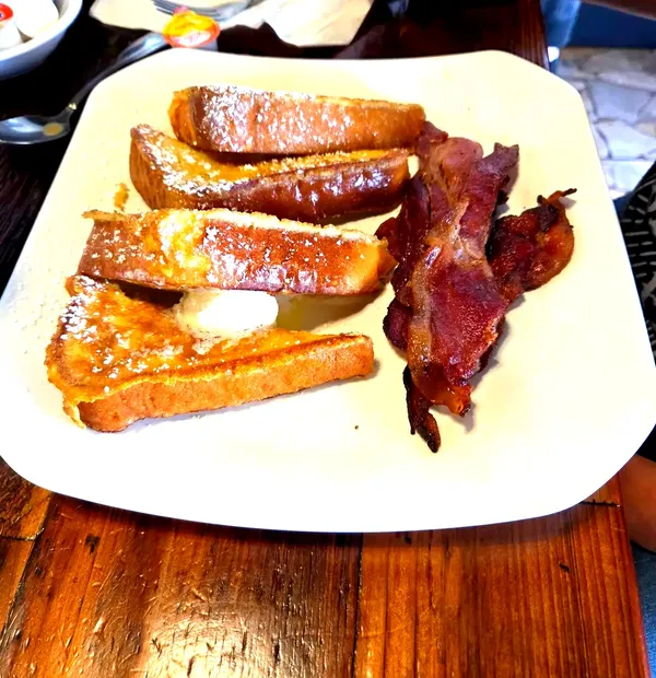 Powdered sugar French toast, bacon, uncomplicated Leander morning
